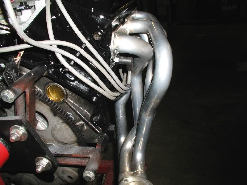 Spark plug wire looms...under header or not? Message